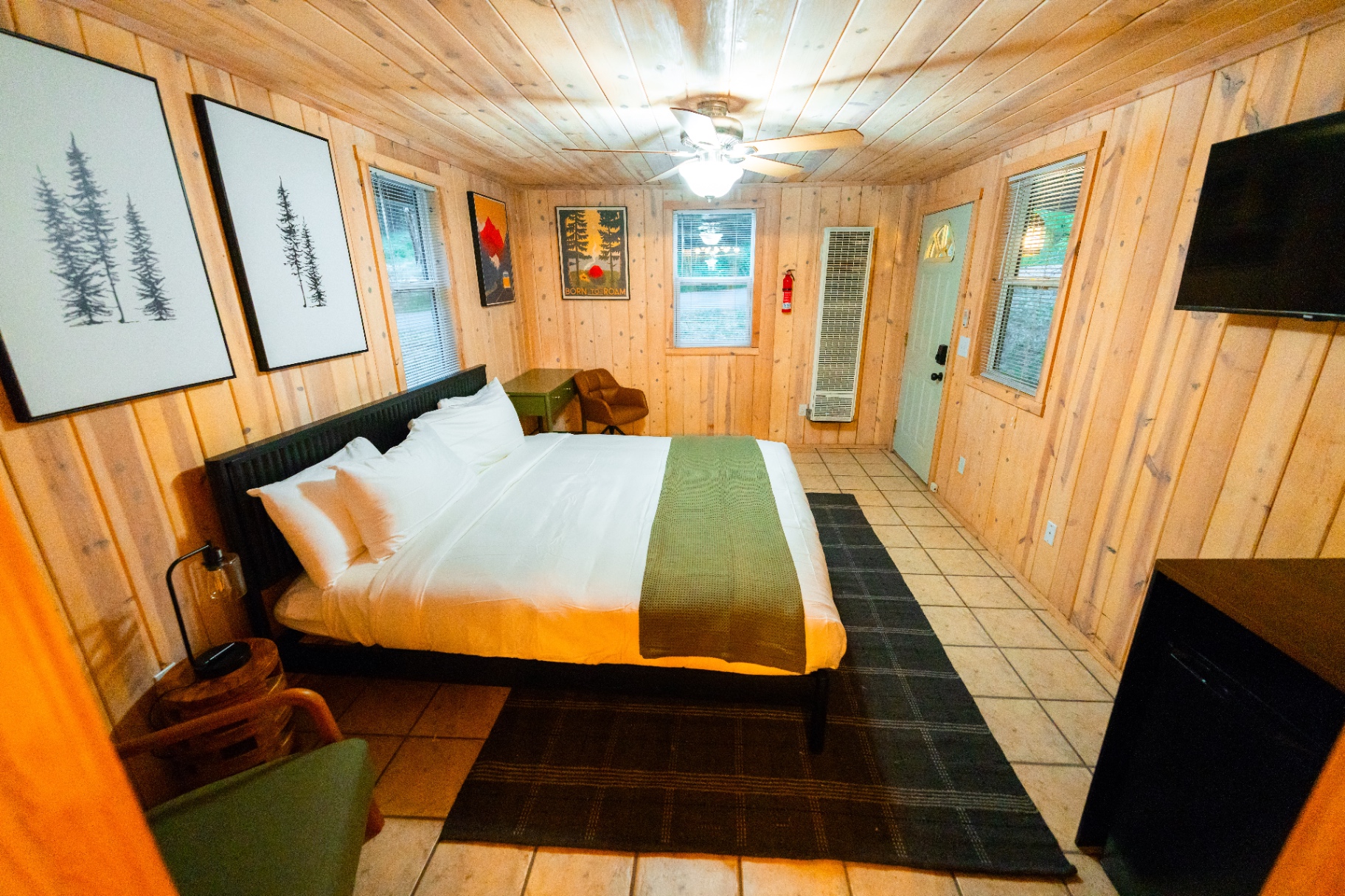 Bright suite with king bed and forest views